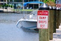 Caution sign at boat ramp