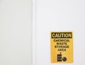 The Caution sign `Chemical Waste Storage Area, a safety sign warning on white wall in laboratory room, useful for caution who work Royalty Free Stock Photo