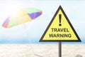 Caution sign of new variant of covid 19 omicron on the beach Royalty Free Stock Photo