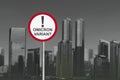 Caution sign of new variant of covid 19 omicron on the city Royalty Free Stock Photo