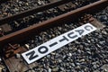Caution sign beside railway track. Royalty Free Stock Photo