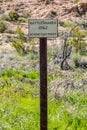 A caution signboard for hikers in Boyce Thompson Arboretum, Arizona