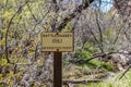 A caution signboard for hikers in Boyce Thompson Arboretum, Arizona