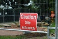 Caution site entrance sign. Royalty Free Stock Photo