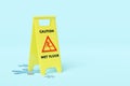 Caution slippery or wet floor caution plastic sign with wet area isolated on blue background. warning symbol, 3d render