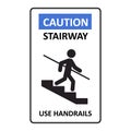 Caution stairway Use Handrails sign. A man goes down the stairs and holds on to the handrail. A sign warning of danger Royalty Free Stock Photo