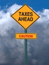 Caution taxes ahead post sign Royalty Free Stock Photo