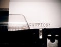 Caution text typed on old black typwriter Royalty Free Stock Photo