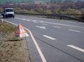 Caution traffic accident sign on the roadside Royalty Free Stock Photo