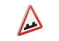 Caution traffic sign warns of uneven road surface ahead Royalty Free Stock Photo