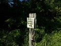 Caution trail subject to flooding enter at own risk sign Royalty Free Stock Photo