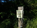 Caution trail subject to flooding enter at own risk sign Royalty Free Stock Photo