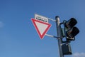 Caution and warning triangular sign with tram symbol and traffic light.