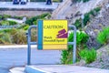 Caution Watch Downhill Speed sign at a steep road in Laguna Beach California