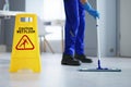 Caution: Wet Floor - Cleaning Janitor Royalty Free Stock Photo