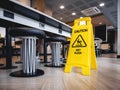 Caution Wet floor signage stand Indoor Restaurant cafe Safety sign Royalty Free Stock Photo