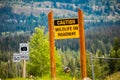 Caution wildlife on roadway warning sign