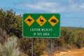 Caution wildlife sign in Australia next to the road - danger of kangaroos emus and mammals Royalty Free Stock Photo