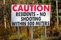 A Cautions Residents, No Shooting Within 500 Meters sign