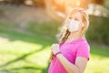 Cautious Girl Wearing Medical Face Mask During Workout Outdoors Royalty Free Stock Photo