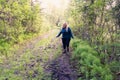 Cautious woman hiker walks through a muddy trail in Kananaskis Country in Alberta Canada Royalty Free Stock Photo