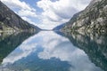 Cavallers reservoir surrounded by high mountains reflected in the water, river Noguera de Tor in Ribagorza, BoÃÂ­ valley, in the