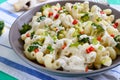 Cavatappi pasta with broccoli, red pepper and cream sauce in a bowl. Vegetarian dish. Delicious wholesome food. Proper nutrition Royalty Free Stock Photo
