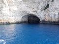 Cave on the blue water of Paxi island greece Royalty Free Stock Photo