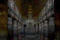 Chaitya interior showing standing Buddha figure over the stupa. Ajanta Caves, Aurangabad, Maharashtra