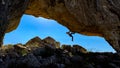 Cave climbing and synergetic movements of adventurous man Royalty Free Stock Photo