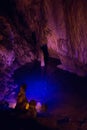 Cave Dim stone texture. The underground lake is blue inside the cave. Alanya, Turkey Royalty Free Stock Photo