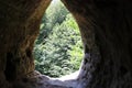 Cave entrance. Cave in the mountains. Beautiful place. Travel to the mountains