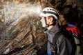 Cave exploration with helmet and headlight Royalty Free Stock Photo