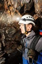 Cave exploration with helmet and headlight Royalty Free Stock Photo