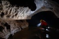 Cave explorer, spelunker, archeologist studying underground passage Royalty Free Stock Photo
