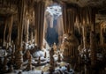 A cave featuring a stunning array of stalactites and stalagmites. The formations are intricate, Royalty Free Stock Photo