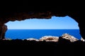 Cave hole in Formentera with blue sea view Royalty Free Stock Photo