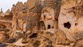 Cave houses and monasteries carved into tufa rocks at Zelve Valley in Cappadocia, Turkey Royalty Free Stock Photo