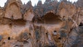 Cave houses and monasteries carved into tufa rocks at Zelve Valley in Cappadocia, Turkey Royalty Free Stock Photo