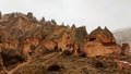 Cave houses and monasteries carved into tufa rocks at Zelve Valley in Cappadocia, Turkey Royalty Free Stock Photo