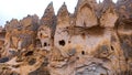 Cave houses and monasteries carved into tufa rocks at Zelve Valley in Cappadocia, Turkey Royalty Free Stock Photo