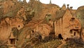 Cave houses and monasteries carved into tufa rocks at Zelve Valley in Cappadocia, Turkey Royalty Free Stock Photo