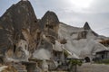 Cave houses and scenic rock formations at the town Goreme in the center of Cappadocia in Turkey Royalty Free Stock Photo