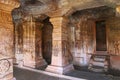 Cave 4 : Interior view. The figure of Mahavira in the sanctum is partially seen, Jaina Tirthankara images engraved on the pillars