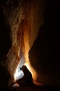 Cave passage with a caver Royalty Free Stock Photo