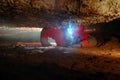 Cave passage with a spelunker Royalty Free Stock Photo