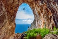 Cave rappel, sea at the background