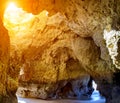 Cave rock formation on Alvor beach and view of sea