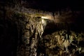 Cave with rock growths with illumination