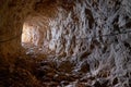 Cave rock tunnel through rock formation Royalty Free Stock Photo